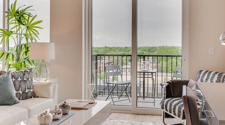 an apartment living room viewing the balcony